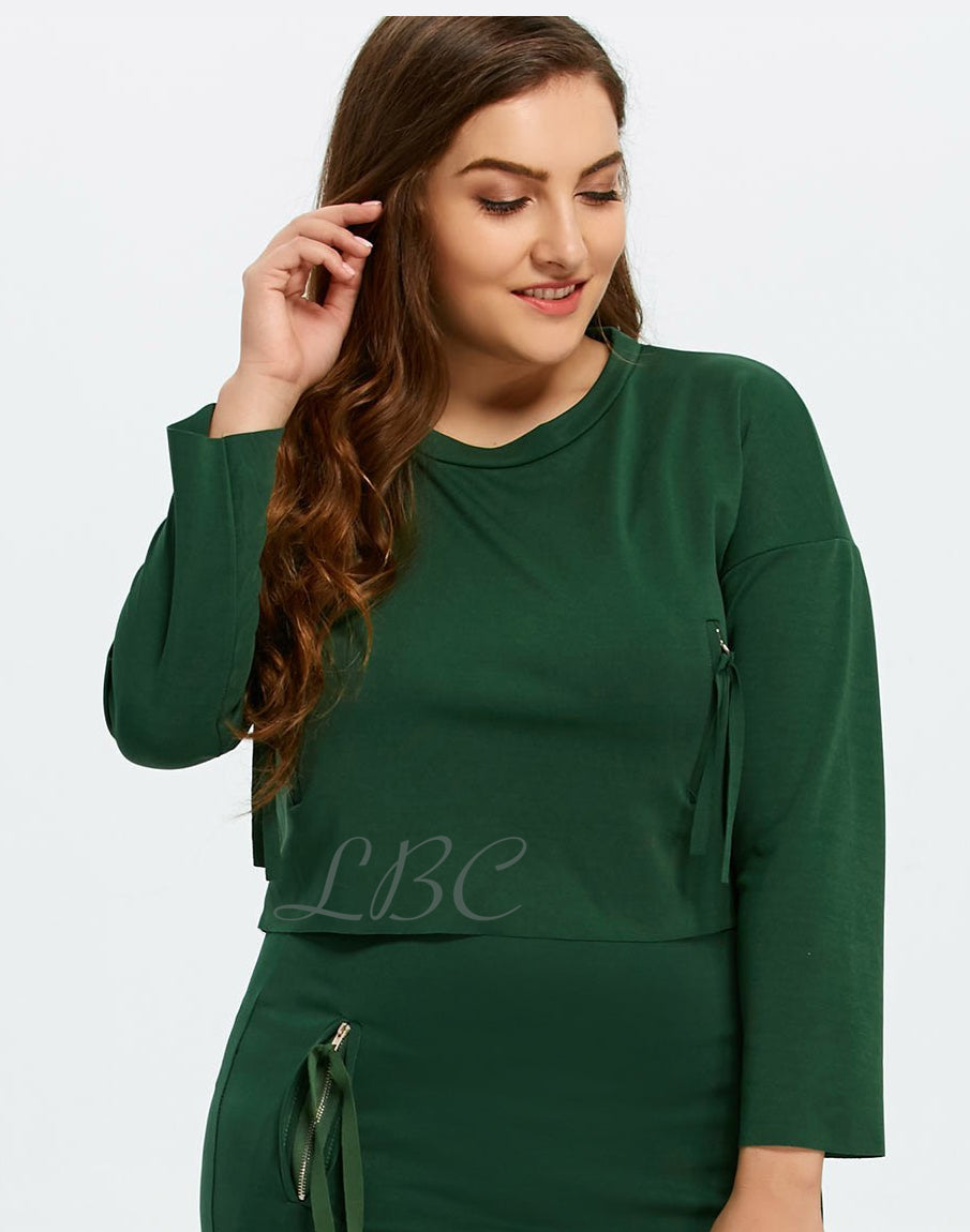 Green knit cropped top with decorative zips and raw edges